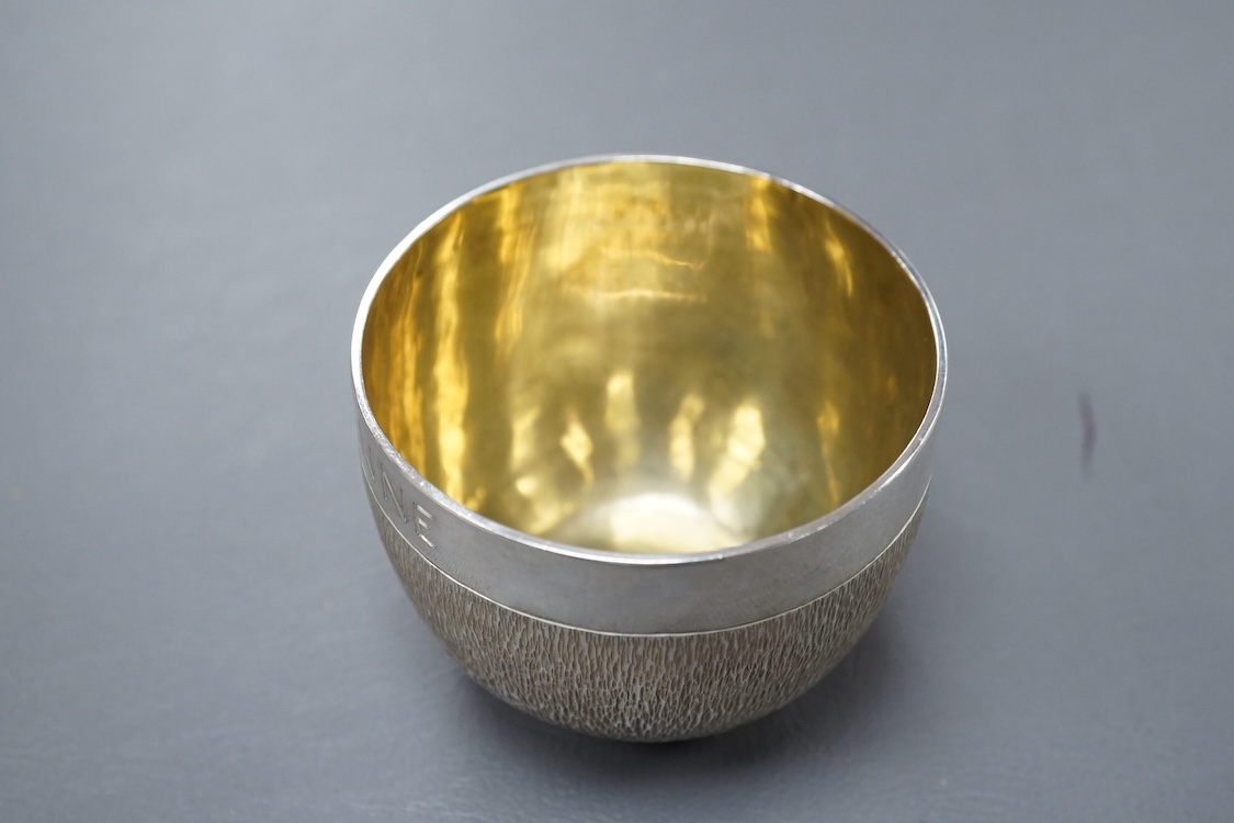 An Elizabeth II textured silver tumbler cup, possibly by Keith Tyssen, London, 1975, with later engraved inscription, height 50mm, 136 grams.
